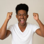 excited african american teenager